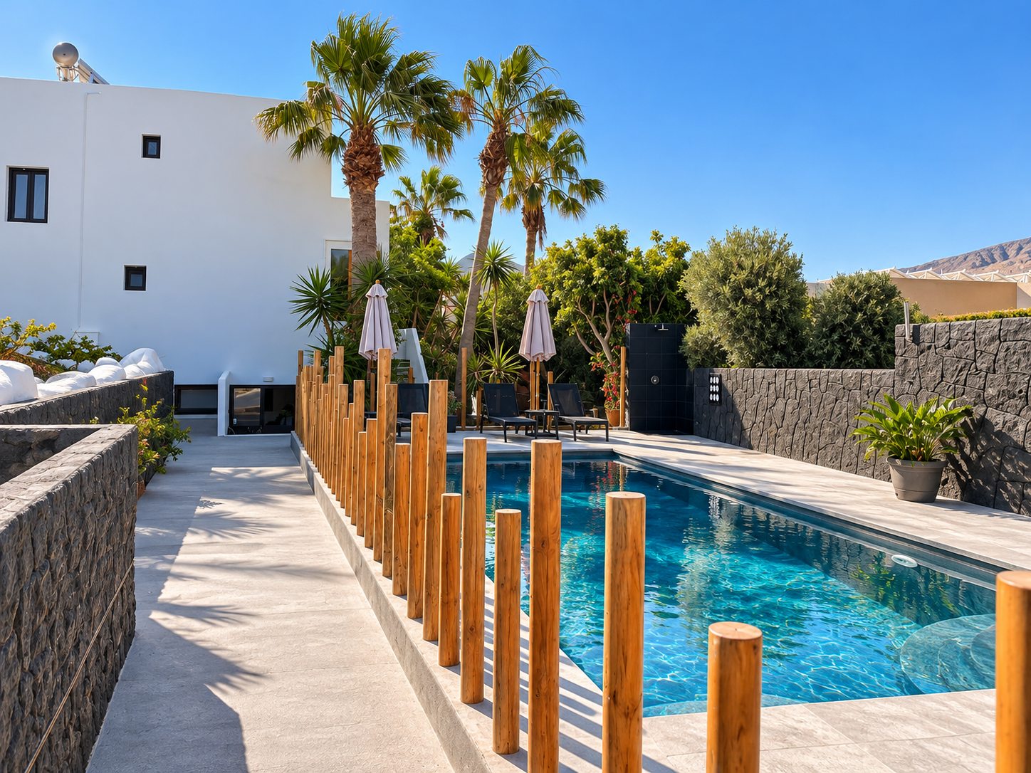 Entrance path beside the pool at Dragonfly Villas