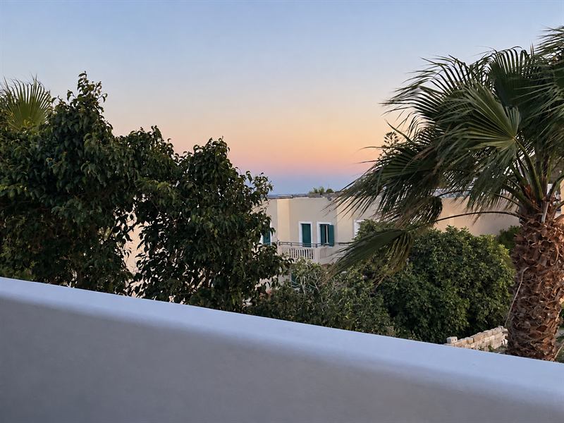 Studio Apartment – Balcony view at sunset, Dragonfly Villas Santorini